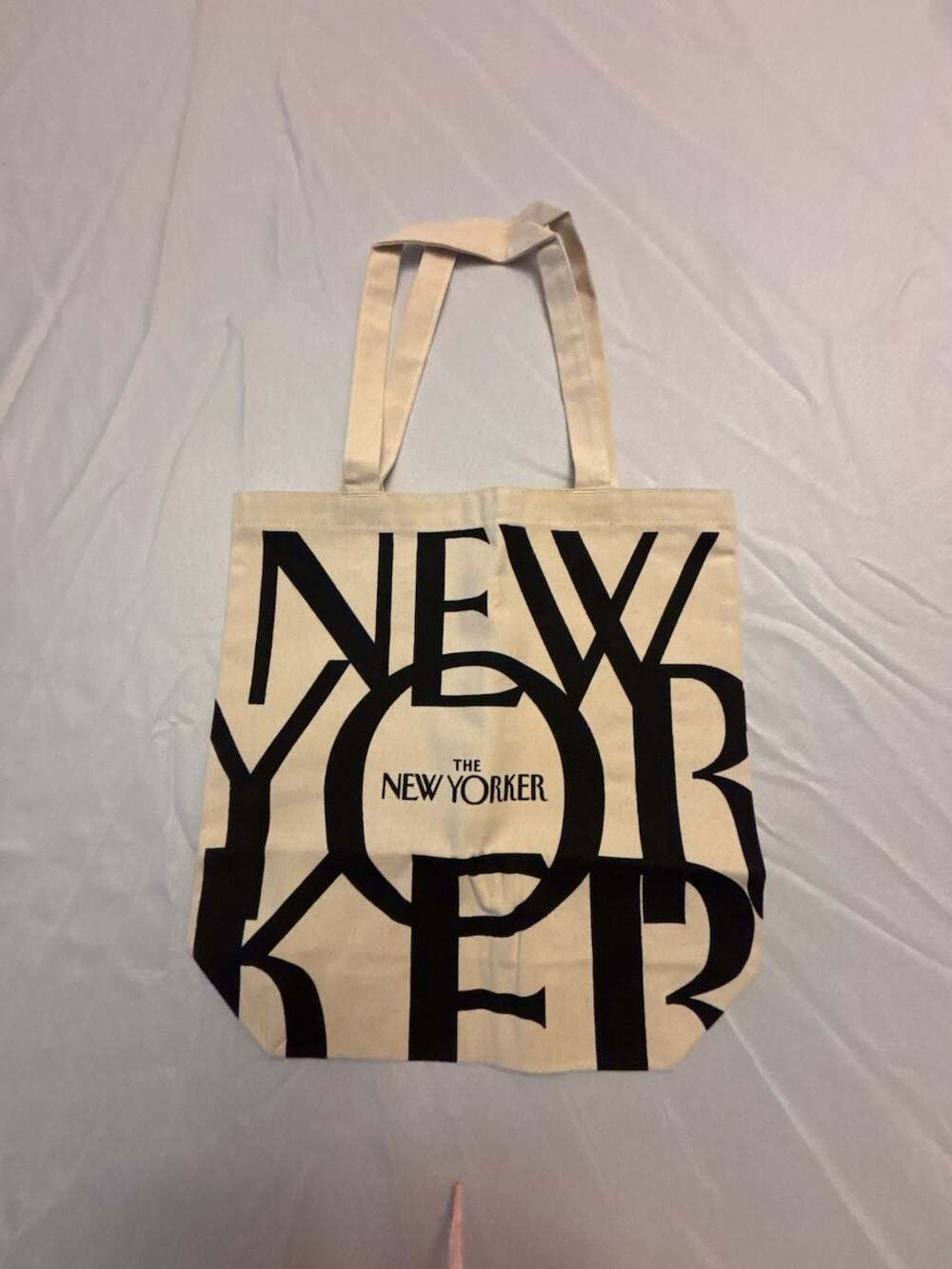 The New Yorker Canvas Tote Bag with Bold Black Logo